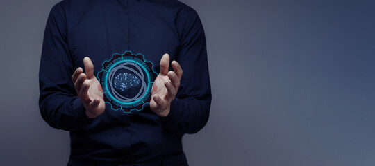 businessman holds a hologram of an artificial intelligence brain. concept of futuristic...