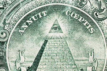 Close up of the Eye of Providence on a old worn US one dollar bill. - Powered by Adobe