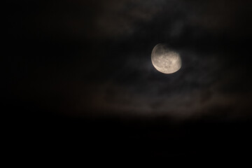 white moon with clouds