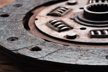 Old car clutch disk close up background. Clutch disk replacement.