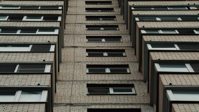 Slow zoom out on a large old panel apartment building