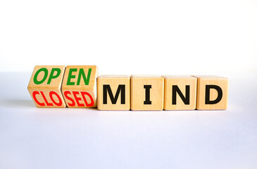 Open or closed mind symbol. Turned wooden cubes and changed concept words closrd mind to open mind. Beautiful white table, white background, copy space. Business open or closed mind concept.