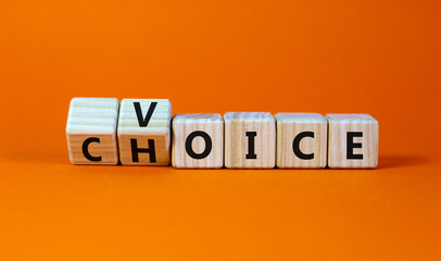 Voice and choice symbol. Turned wooden cubes and changed the concept word choice to voice. Beautiful orange table, orange background, copy space. Business and voice and choice concept.