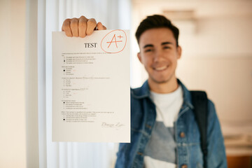 Close-up of student gets A+ grade on test in high school.