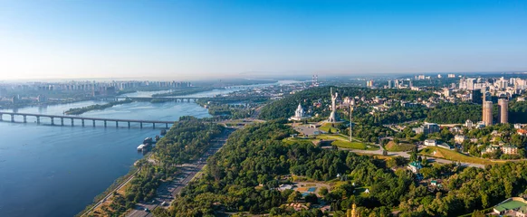 Fototapeten Aerial view of the Dnepr river in Kyiv near Mother Motherland monument. Beautiful scenic view of Kyiv. © ingusk