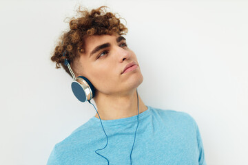 kinky guy in blue t-shirts headphones fashion isolated background