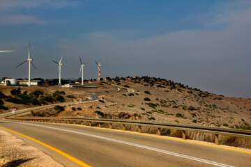 road stretching into the distance, windmills along the road