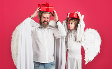 Valentines angels with present box. Father and son with white wings with Gift box. Valentine day.