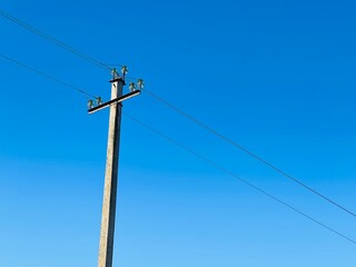 Closeup of old power line. Power transmission line pole with power lines attached