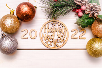 Happy new year 2022 on wooden white background
