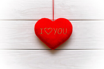 A symbol of love on white wooden background
