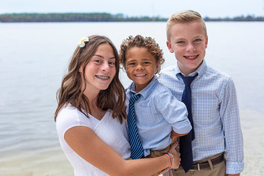 Portrait Of Diverse Group Of Beautiful Children In Formal Dress. Cute Smiling Faces Of Hispanic Girl, African American Boy And Caucasian Boy.