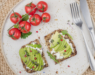 healthy breakfast with avocado and tomatoes 
