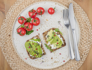 healthy breakfast with avocado and tomatoes 