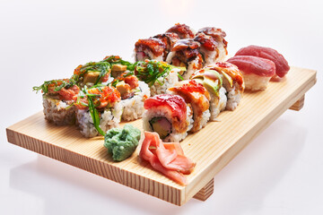  Wooden board of sushi isolated over white background