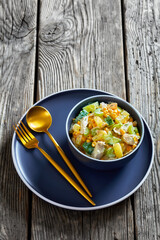 salad of chicken breast, corn, ananas, cucumber