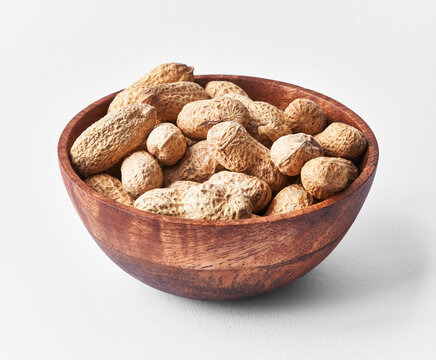  Bowl of peanuts with shell isolated on a white background