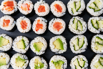  Group of avocado, salmon and cucumber sushi makis texture
