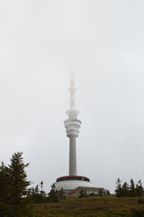 Obraz premium Lookout tower and transmmiter on top of the hill Praděd in Czechia in summer.