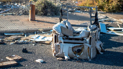 rubble and garbage thrown and abandoned on the street in a vacant lot and abandoned circuit in the canary islands with unrecycled garbage and construction materials cables, thermo