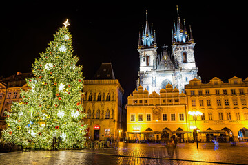 Fototapeta premium Prague, Czech republic - December 29, 2021. Night photo of Old Town Square without Christmas markets banned due Coronavirus caused empty streets without tourists