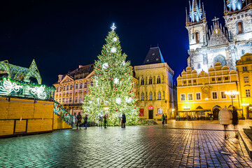 Fototapeta na wymiar Prague, Czech republic - December 29, 2021. Night photo of Old Town Square without Christmas markets banned due Coronavirus caused empty streets without tourists