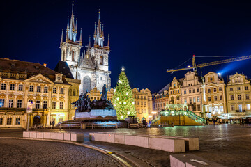Fototapeta na wymiar Prague, Czech republic - December 29, 2021. Night photo of Old Town Square without Christmas markets banned due Coronavirus caused empty streets without tourists