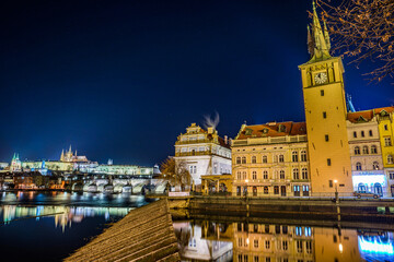 Prague, Czech republic - December 29, 2021. Winter night photo of Prague Castle with Novotneho lavka