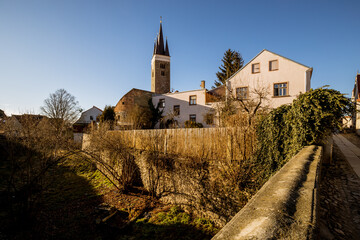 View of the city of Telc in the winter sunset.
The picturesque castle and the historic center with the decorative facades of the houses belong to the UNESCO World Heritage Site, Czech Republic.