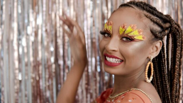 Carnaval Party in Brazil, close up of brazilian black woman dancing samba at studio in costume