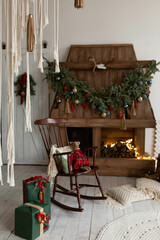 white room with white fireplace. white stone fireplace in the bedroom. new year's design. Christmas tree