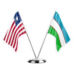 Two table flags isolated on white background 3d illustration, liberia and uzbekistan