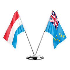 Two table flags isolated on white background 3d illustration, luxembourg and tuvalu