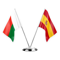 Two table flags isolated on white background 3d illustration, madagascar and spain