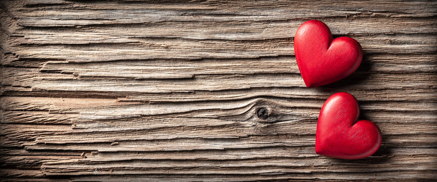Two Red Wooden Hearts On Rustic Table Background - Valentine's Day 