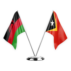 Two table flags isolated on white background 3d illustration, malawi and timor leste