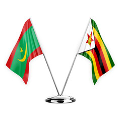 Two table flags isolated on white background 3d illustration, mauritania and zimbabwe