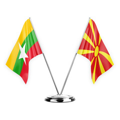 Two table flags isolated on white background 3d illustration, myanmar and north macedonia