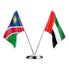 Two table flags isolated on white background 3d illustration, namibia and united arab emirates