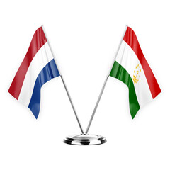 Two table flags isolated on white background 3d illustration, netherlands and tajikistan