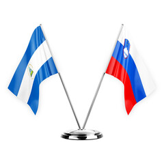 Two table flags isolated on white background 3d illustration, nicaragua and slovenia