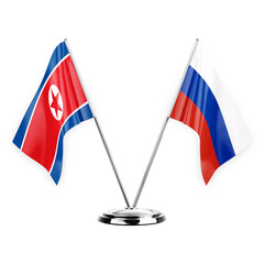 Two table flags isolated on white background 3d illustration, north korea and russia