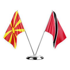 Two table flags isolated on white background 3d illustration, north macedonia and tobago