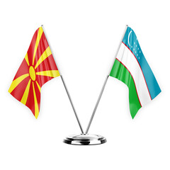 Two table flags isolated on white background 3d illustration, north macedonia and uzbekistan