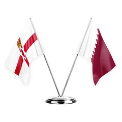 Two table flags isolated on white background 3d illustration, northern ireland and qatar