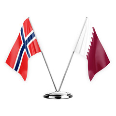 Two table flags isolated on white background 3d illustration, norway and qatar