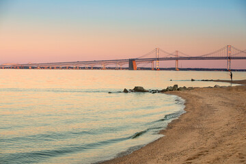 chesapeake bay bridge with calm inlet at sunset - Powered by Adobe