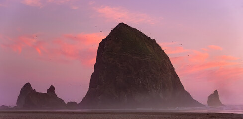 Obraz na płótnie Canvas cannon beach haystack rock oregon pacific northwest america with sunset