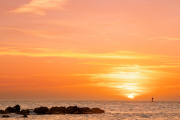 .swimmers at sunset in the atlantic ocean off florida