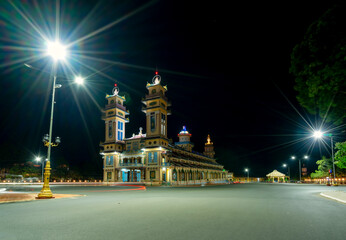 Architecture outside holy temple in night was built in 1926, the temple is turned on at night to pray on the 1st of the holiday season in Tay Ninh, Vietnam